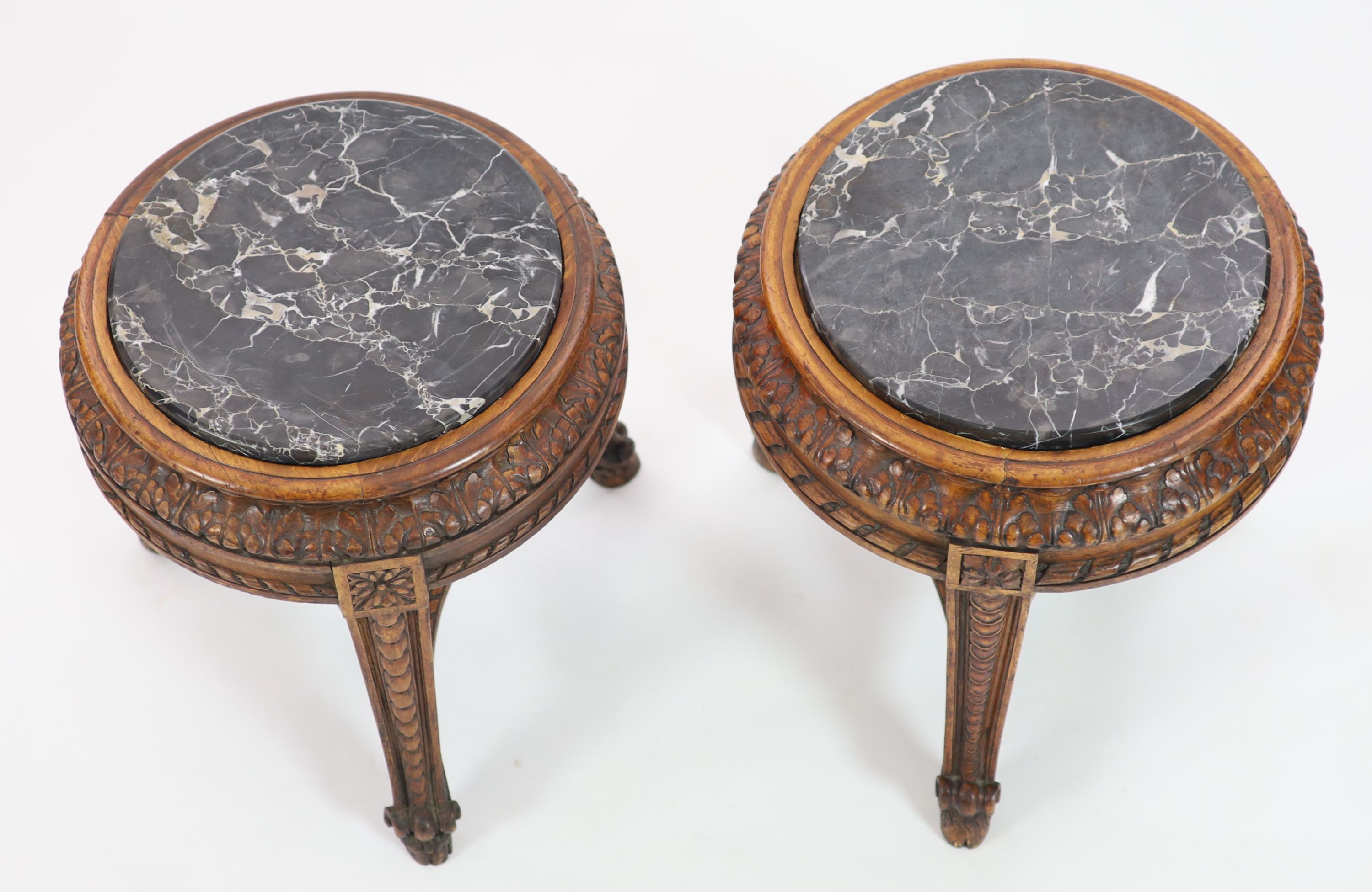 A pair of Italian circular carved walnut marble top vase stands, diameter 40cm, height 44cm